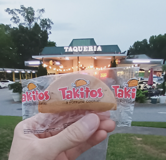 Takitos taco-shaped fortune cookie being served at restaurant