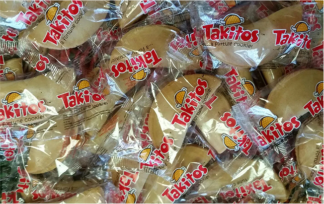 Pile of Takitos taco shaped fortune cookies